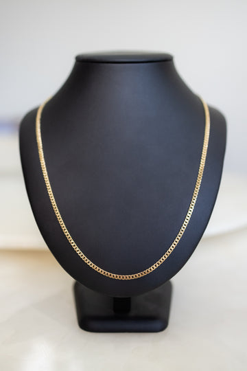 Front view of the handmade 18ct gold Cuban link chain with lobster clasp fastened