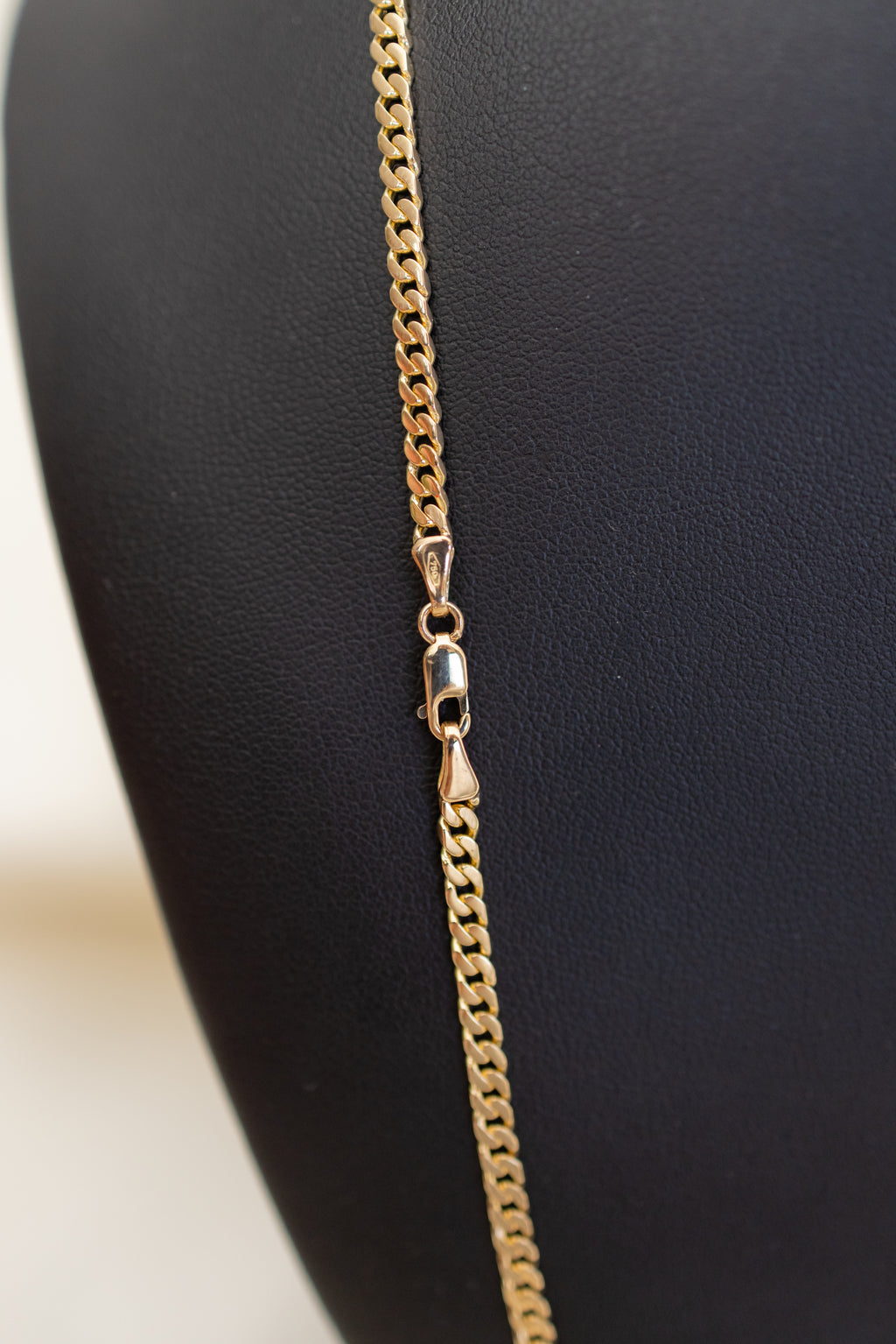 Lobster clasp detail on the solid 18ct yellow gold handmade Cuban link chain