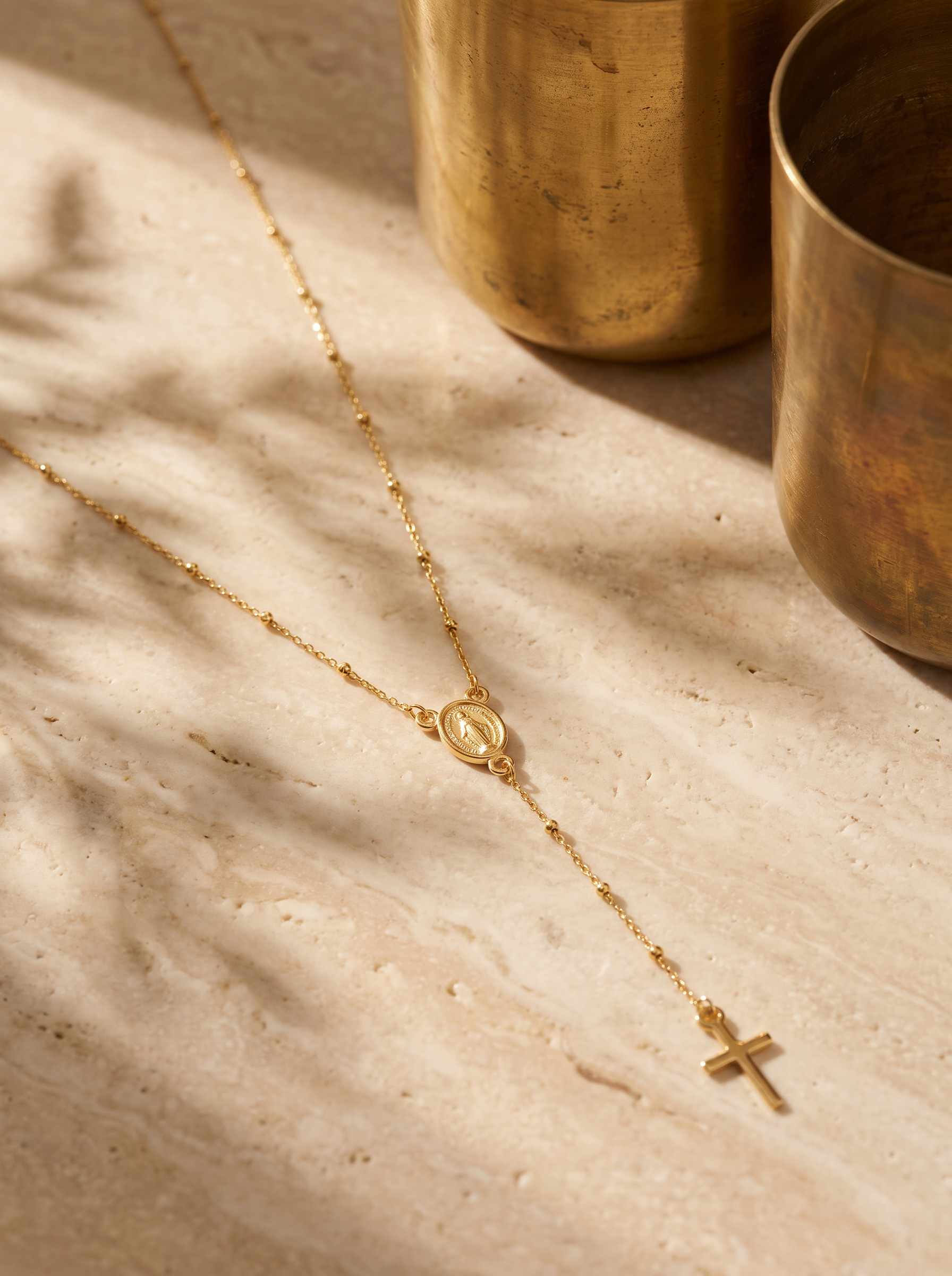 9ct gold Madonna rosary necklace styled on stone