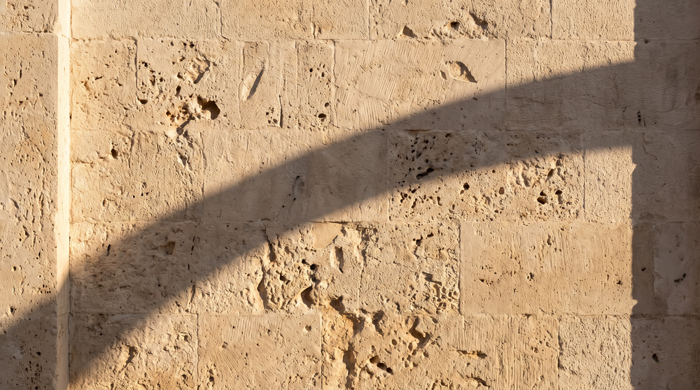 Warm Croatian limestone with the soft shadow of an arch