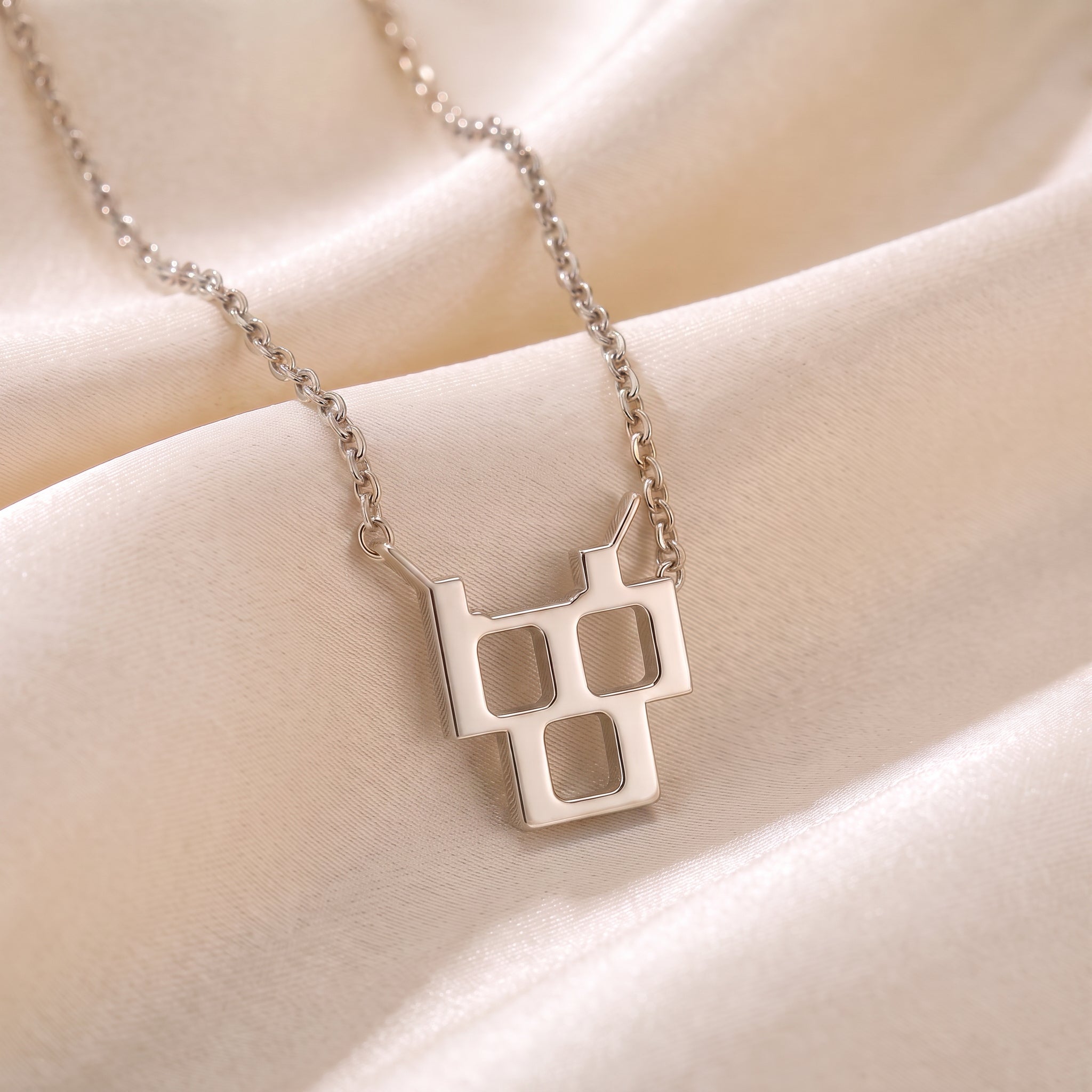Glagolitic letter Č (Črv) pendant necklace in 9ct white gold on silk