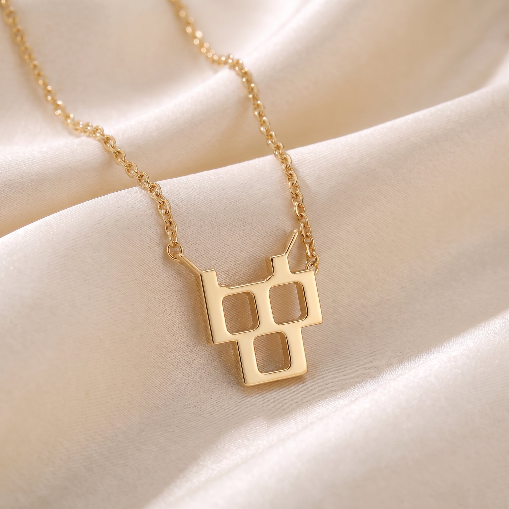 Glagolitic letter Č (Črv) pendant necklace in 9ct yellow gold on silk