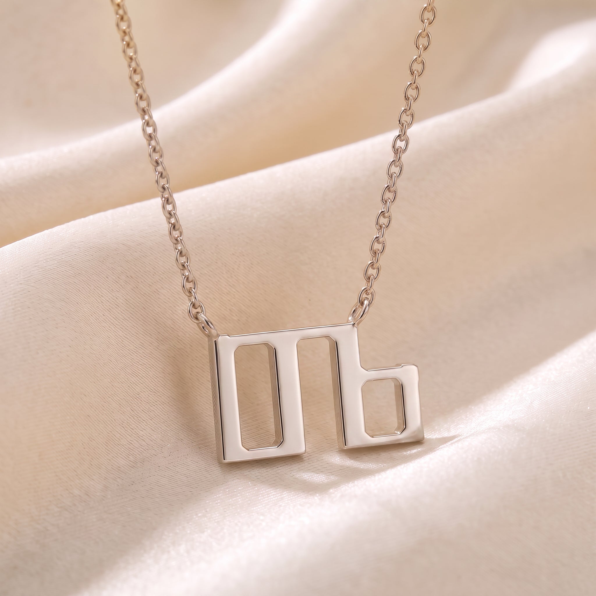 Glagolitic letter D (Dobro) pendant necklace in 9ct white gold on silk