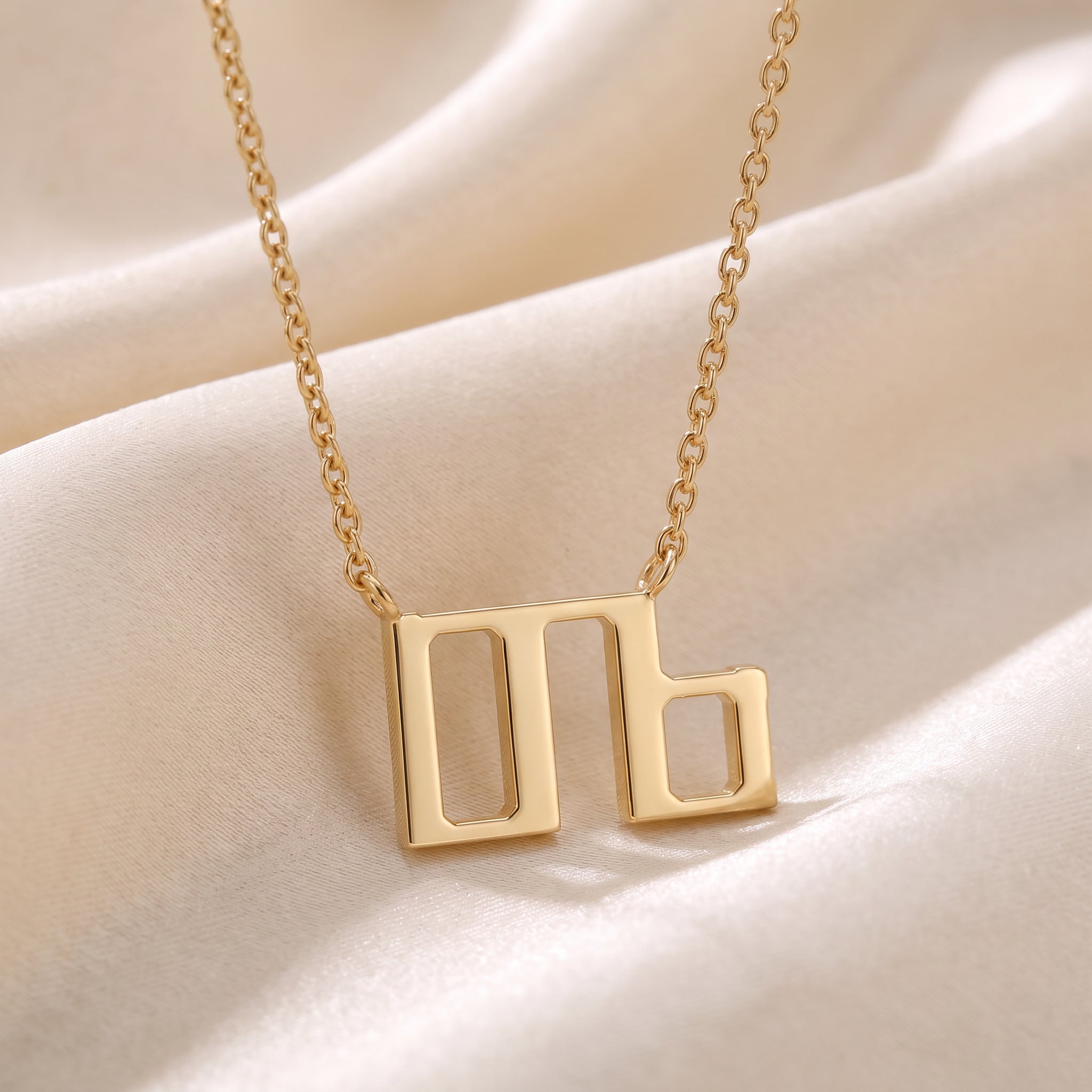 Glagolitic letter D (Dobro) pendant necklace in 9ct yellow gold on silk