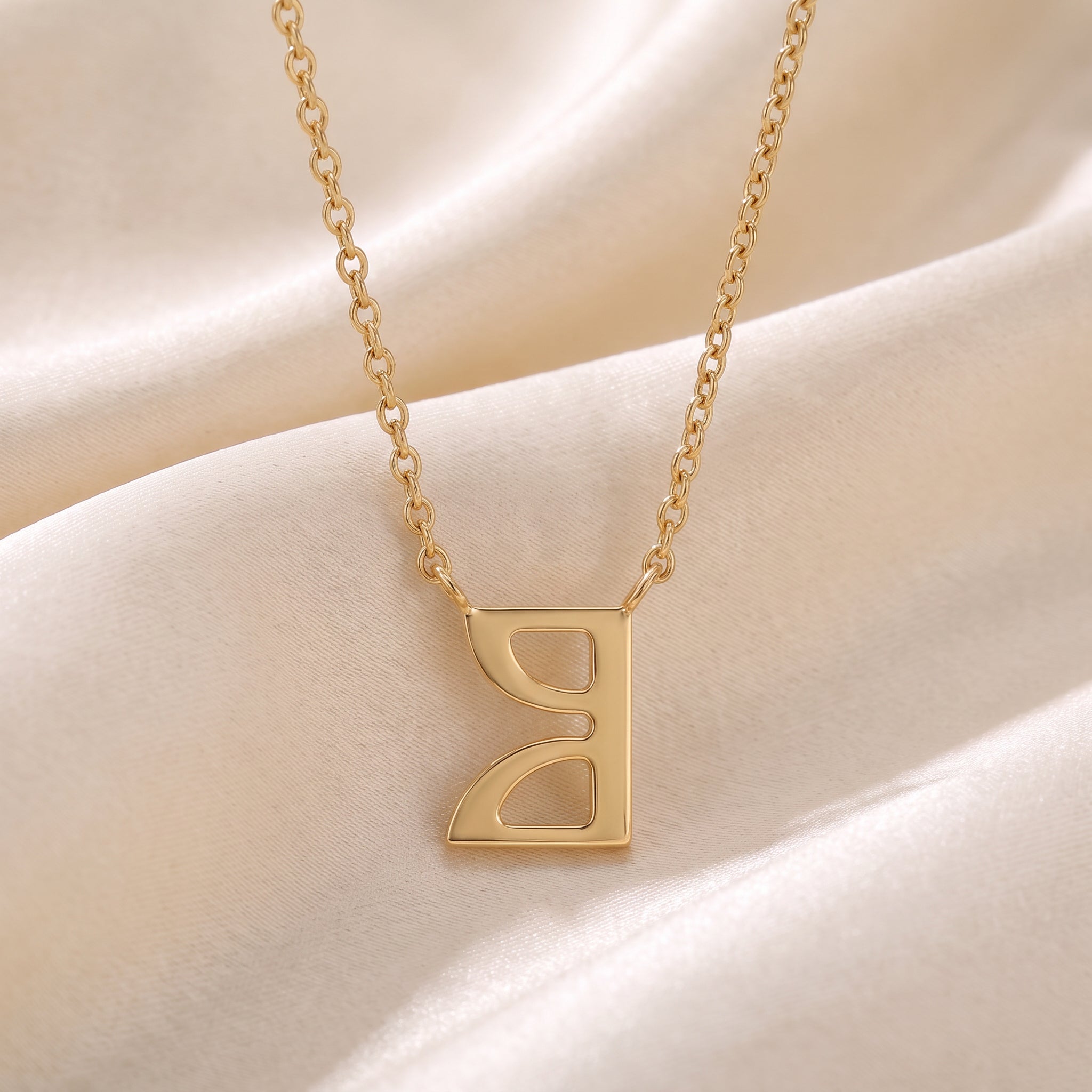 Glagolitic letter O (On) pendant necklace in 9ct yellow gold on silk