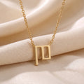 Glagolitic letter P (Pokoj) pendant necklace in 9ct yellow gold on silk
