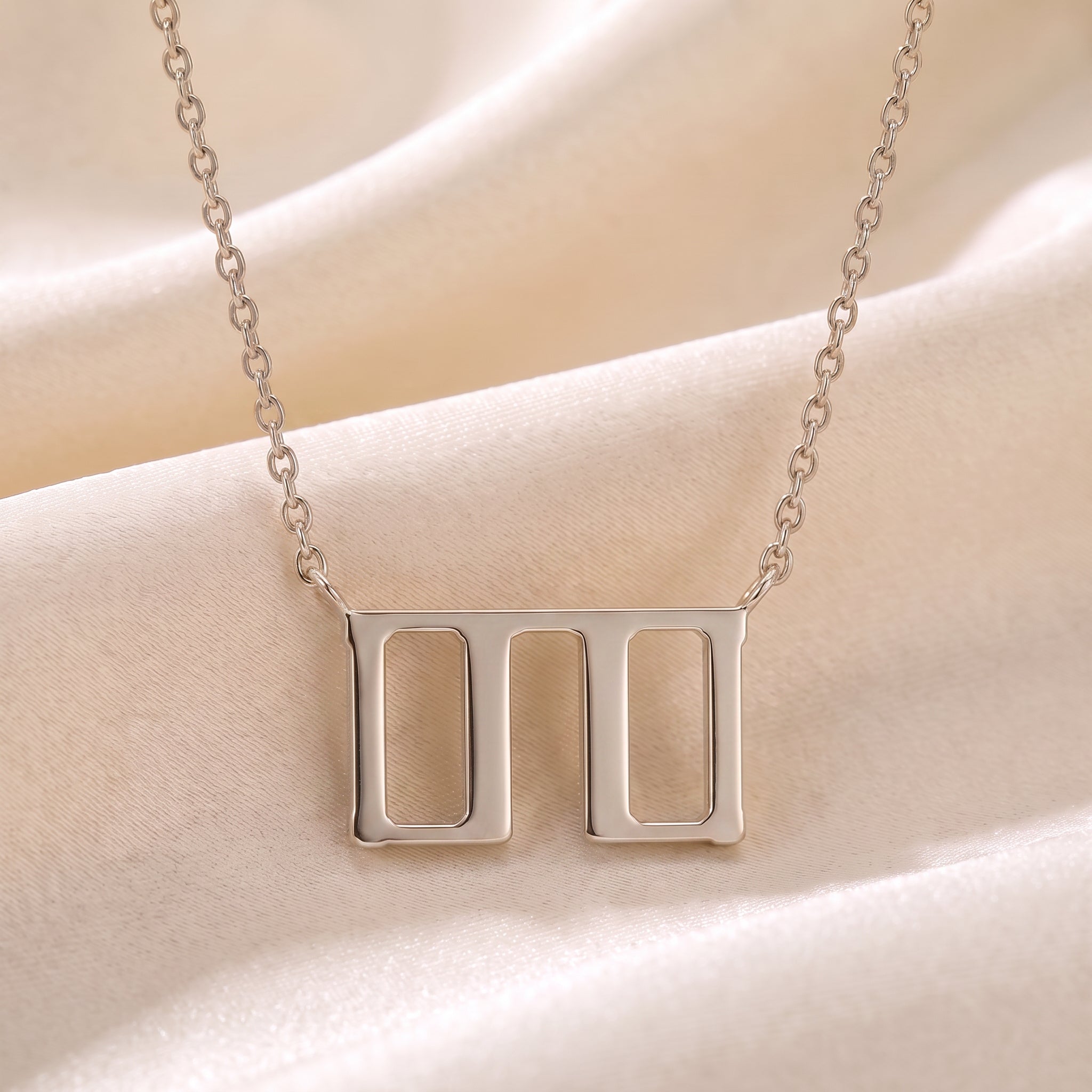 Glagolitic letter T (Tvrdo) pendant necklace in 9ct white gold on silk