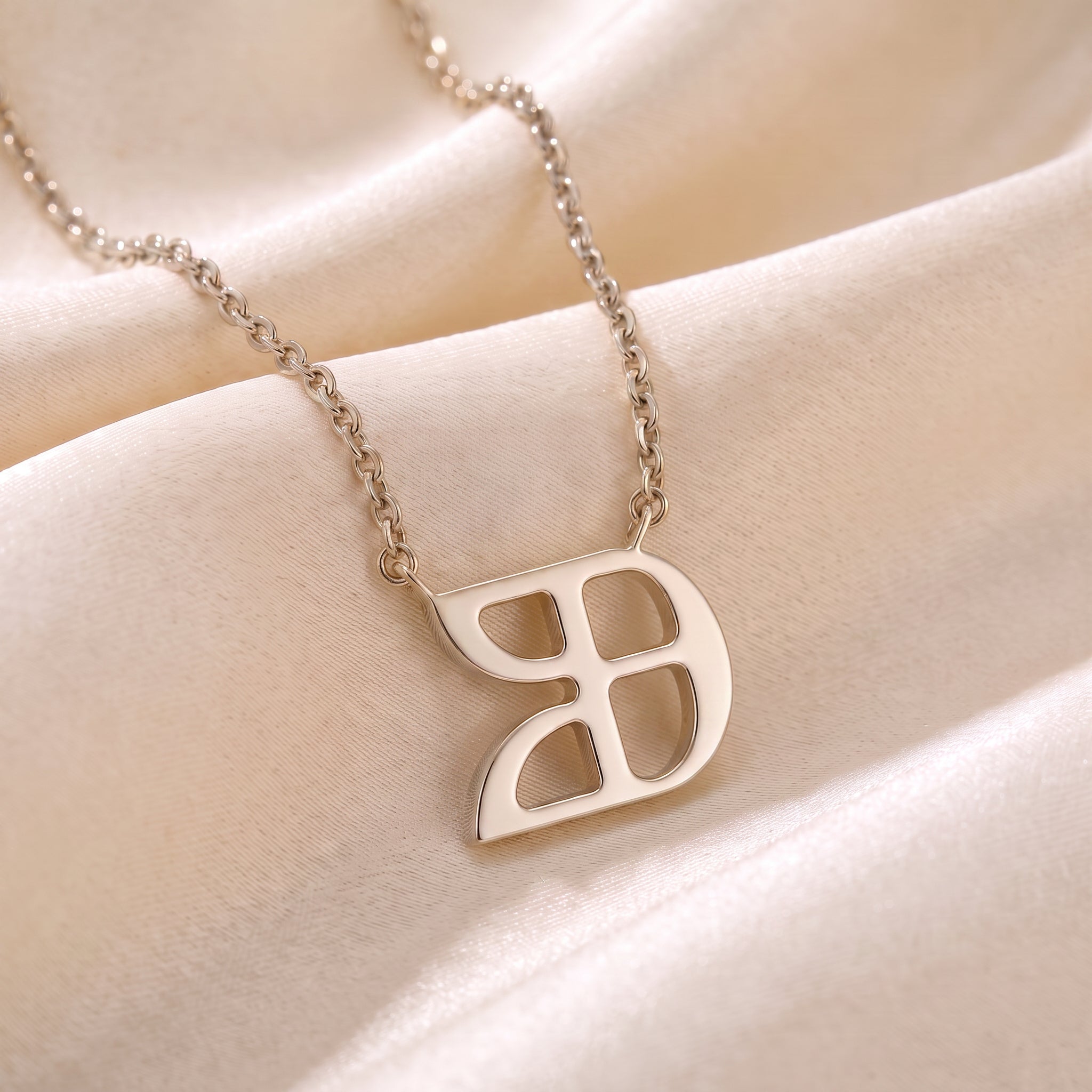 Glagolitic letter U (Uk) pendant necklace in 9ct white gold on silk