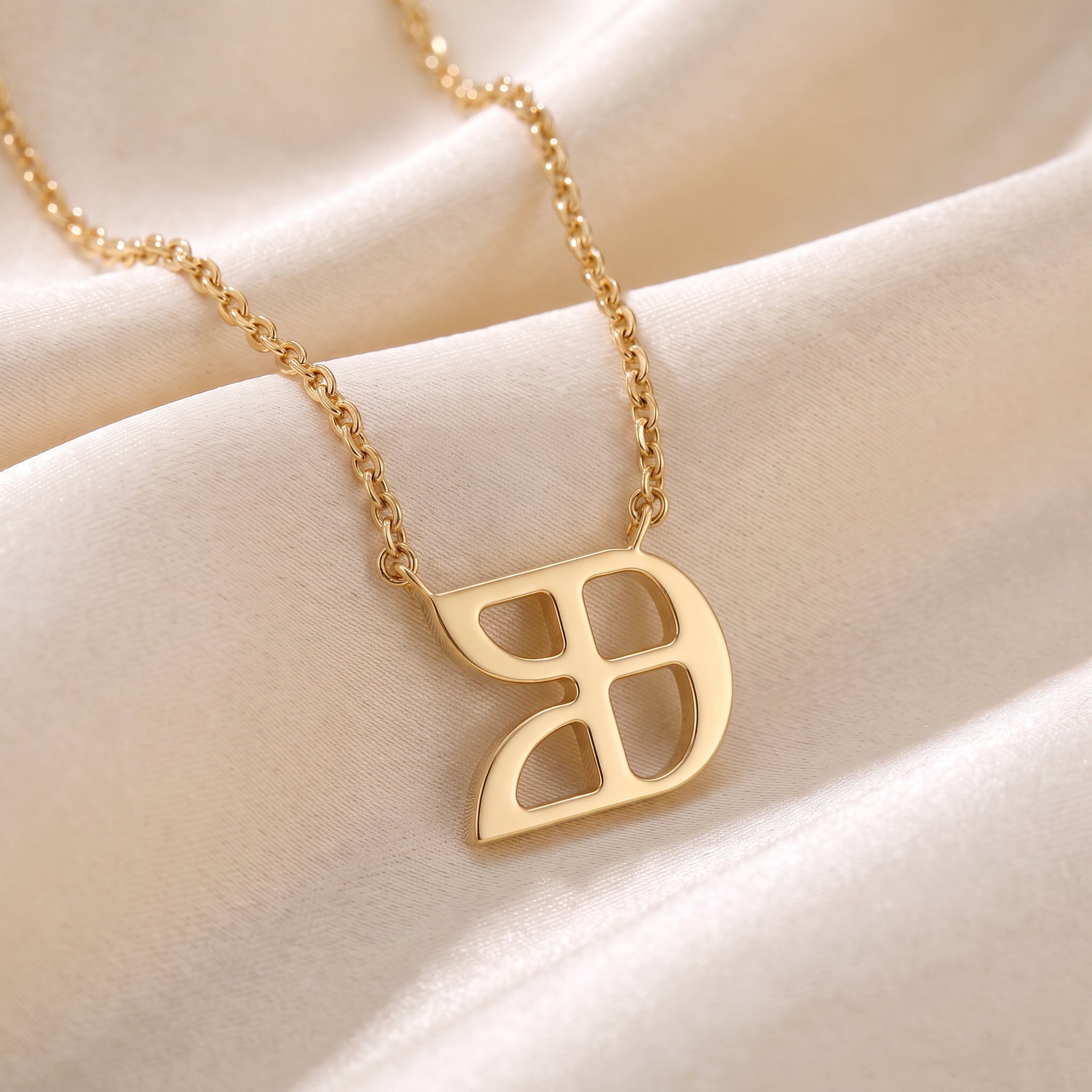Glagolitic letter U (Uk) pendant necklace in 9ct yellow gold on silk