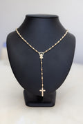 Solid 9ct gold rosary necklace seen front on, the crucifix hanging below the Marian centrepiece