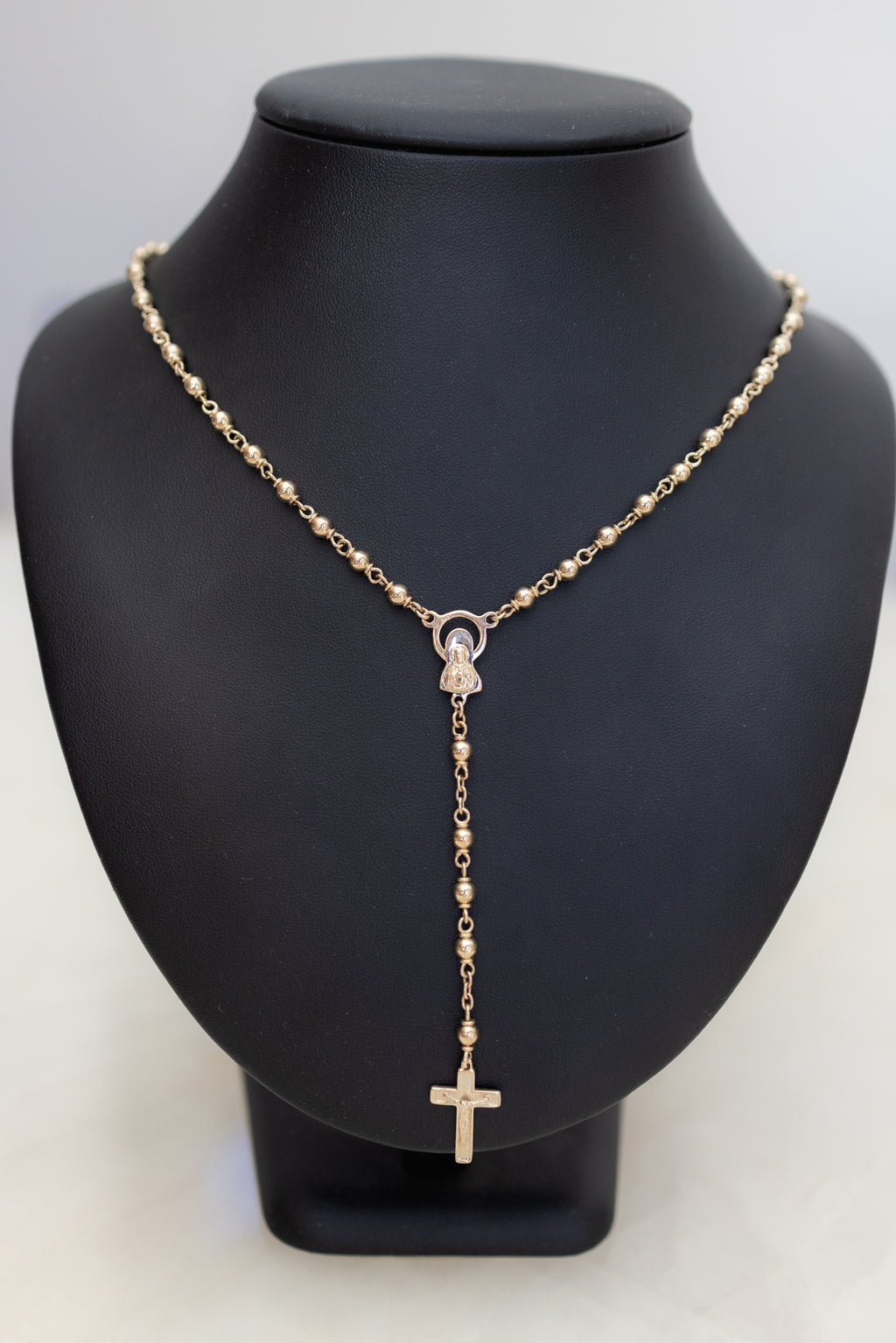 Full front view of the 9ct gold rosary necklace showing the complete run of gold beads