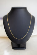 Handmade 1.7mm cable chain in 9ct yellow gold on a display bust, front view