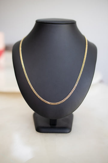 Handmade 3.3mm Cuban link chain in solid 9ct yellow gold, 55cm, shown full length