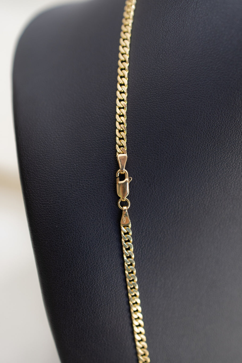 Lobster clasp and hallmarked tag on the handmade 3.3mm 9ct yellow gold Cuban link chain