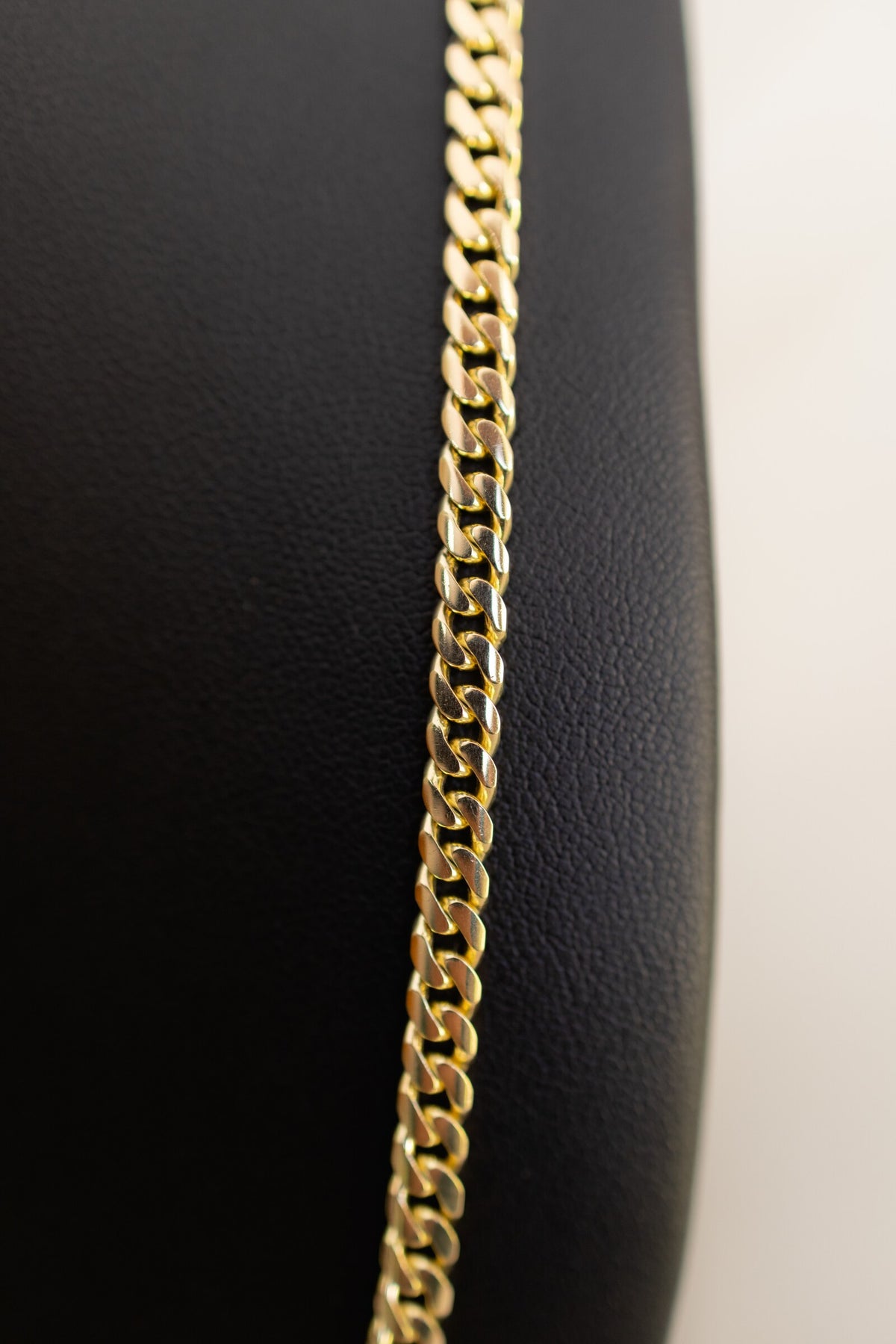 Macro detail of the heavy polished Cuban links on the 4.4mm handmade 9ct gold chain