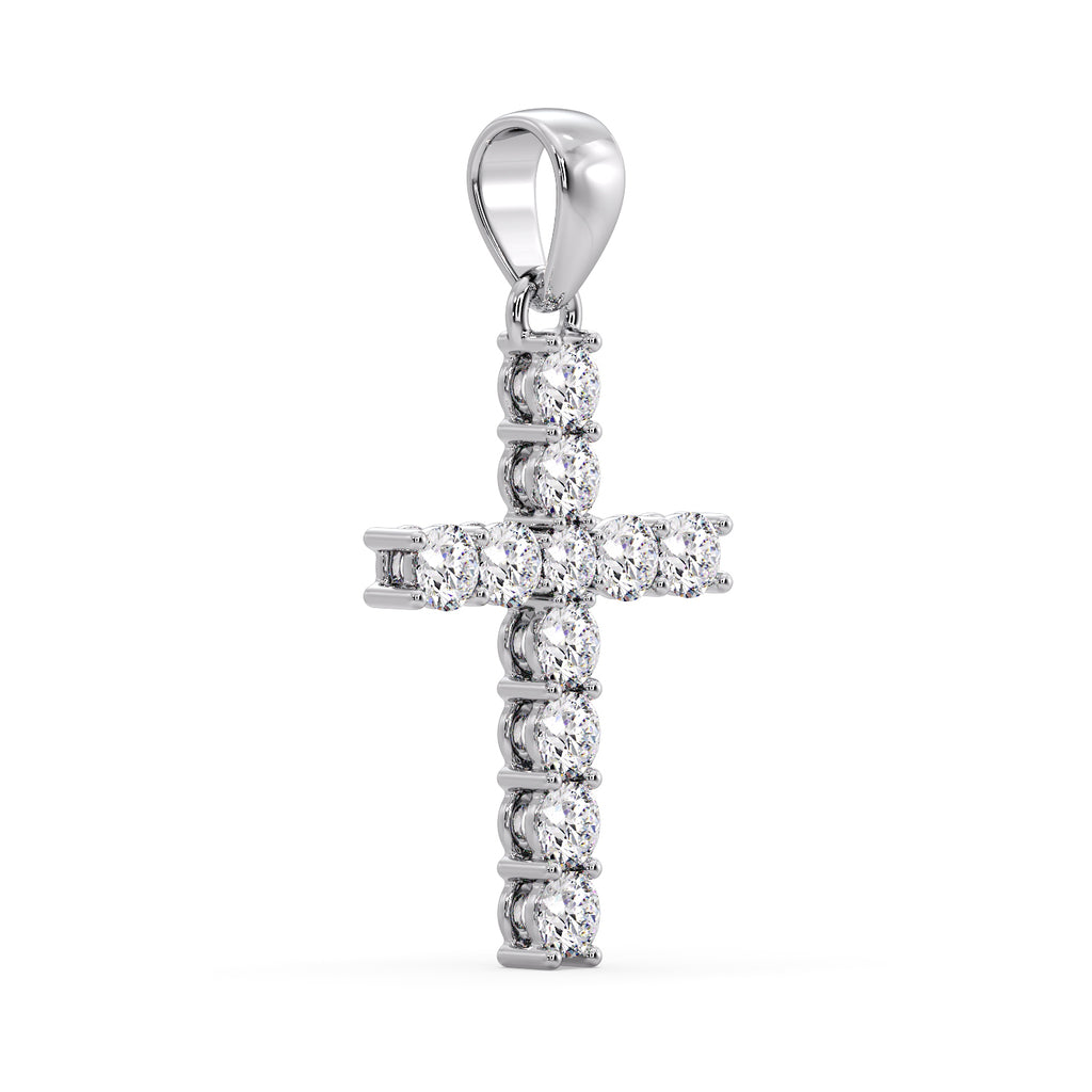 White gold diamond cross pendant at an angle, showing the four-claw settings
